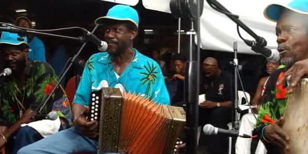 A group of men from Andros Island playing an accordion in Congo Town, Bahamas.