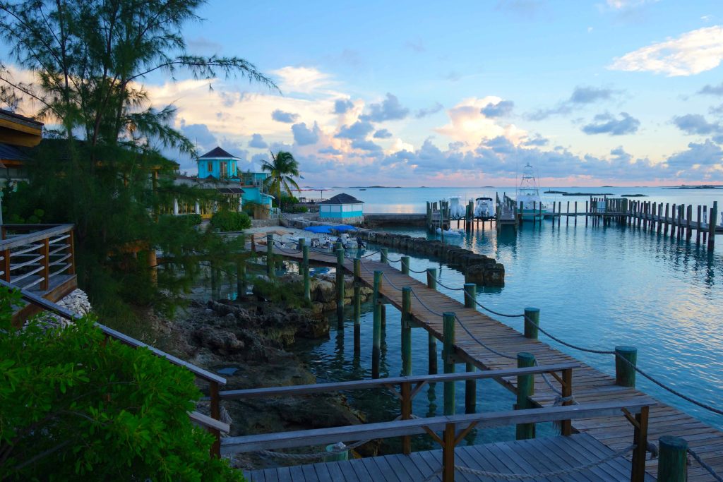A wooden walkway leading to a dock at dusk at Staniel Cay, Yacht Club.